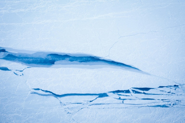 Areal photo of cracked ice on the arctic