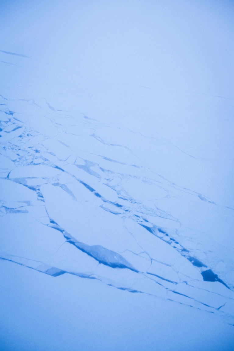 Areal photo of cracked ice on the arctic